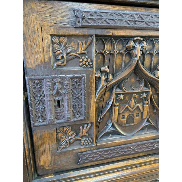 These Gothic cabinets date to the late 1800's or early 1900's and was crafted in France. Made of oak, it features an upper...