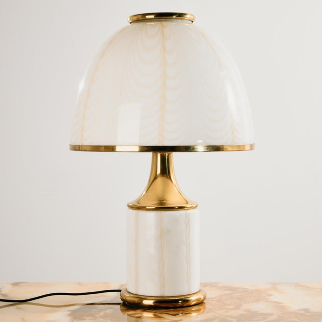 Mazzega table lamp from the 1970s, designed by F. Fabbian. The Murano glass shade and body is decorated with white and...