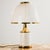 Mazzega table lamp from the 1970s, designed by F. Fabbian. The Murano glass shade and body is decorated with white and...