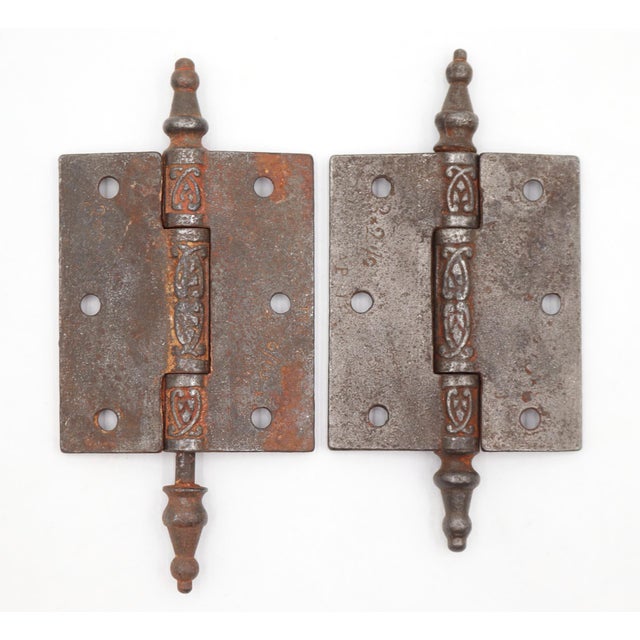 Victorian style door hinges made of cast iron with steeple tips, three knuckles, and a template hole pattern. The original...