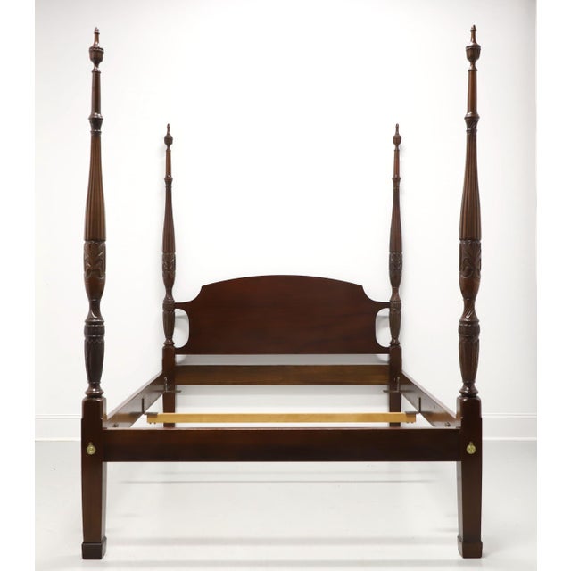 A Traditional Chippendale style queen size poster bed by Councill Craftsmen. Mahogany with solid headboard, four rice...