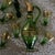 E ight piece vintage, mid century modern green blown glass decanter (1), stopper (1), and glassware (6) with gold gilding...