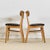 A graceful set of four Danish dining chairs , handcrafted in solid oak by Farstrup during the 1960s . Each chair reflects...
