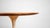 Vintage Eero Saarinen for Knoll International tulip side table with walnut veneer top and white base, circa 1970s. From...