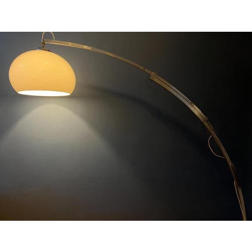 One of a kind arc floor lamp with extendable arm and mushroom shade. We are not sure about the brand, but it has the looks...