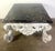 Monumental rectangular, ornate Rococo style coffee table featuring a dark, polished marble top with natural veining and...