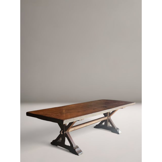 Early 19th century French X Frame Refractory or Farmhouse Table in Walnut. A massive antique table with beautifully...