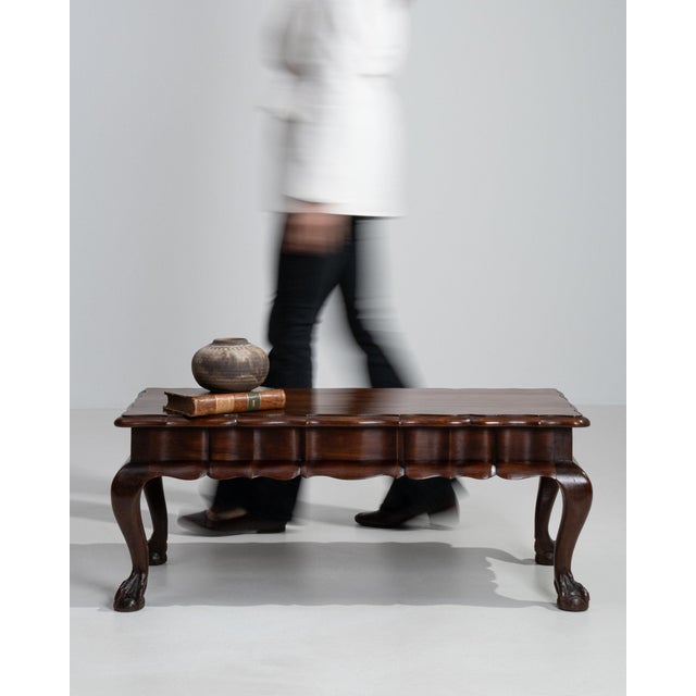 This piece presents as a table, distinguished by dark mahogany, carved ball-and-claw. Originating in France during Early...