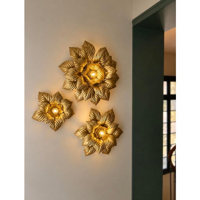Gold metal sconces in very good condition. 1970s. Some slight signs of wear and incidents on the metal visible in the...