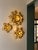 Gold metal sconces in very good condition. 1970s. Some slight signs of wear and incidents on the metal visible in the...