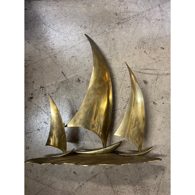 Mid 20th century, 1960s, Brass sculpture depicting 3 sailboats sailing across the water. Measures 20” tall , width and...