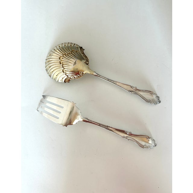 A two-piece Victorian silverplate serving set manufactured by Rogers & Hamilton in the 1896 Raphael pattern. This lovely...