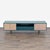 This mid-century-inspired silhouette is defined by a bold veneer façade and textural rattan drawers. It sits on brass...