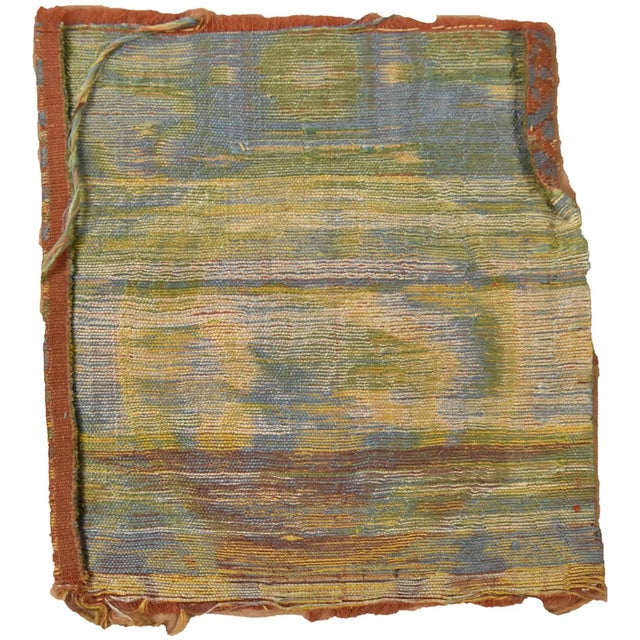 A very rare silk brocade Mongol Yuan dynasty textile fragment featuring a medallion-style pattern of an ancient style...