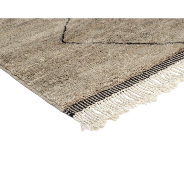 Exquisite and high quality hand-knotted wool rug featuring a harmonious earthy blend of Misty Taupe, Chocolate Brown, and...