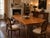 An exceptional monumental dining table by Mastercraft, showcasing the dramatic materials and elaborate detailing...