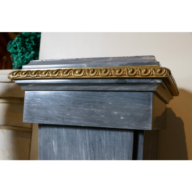 Marble column with ormolu decoration.