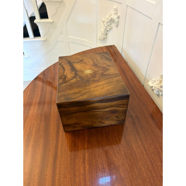 A very attractive Victorian figured walnut writing slope of rich colour and striking grain. The exterior displays...