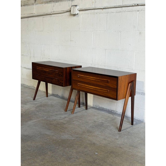 These elegant bedside tables showcase exceptional rosewood with dramatic book-matched grain, sculptural solid rosewood...