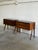 These elegant bedside tables showcase exceptional rosewood with dramatic book-matched grain, sculptural solid rosewood...