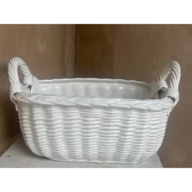 Pure white, rectangle and double handled ceramic basket made in Italy.
