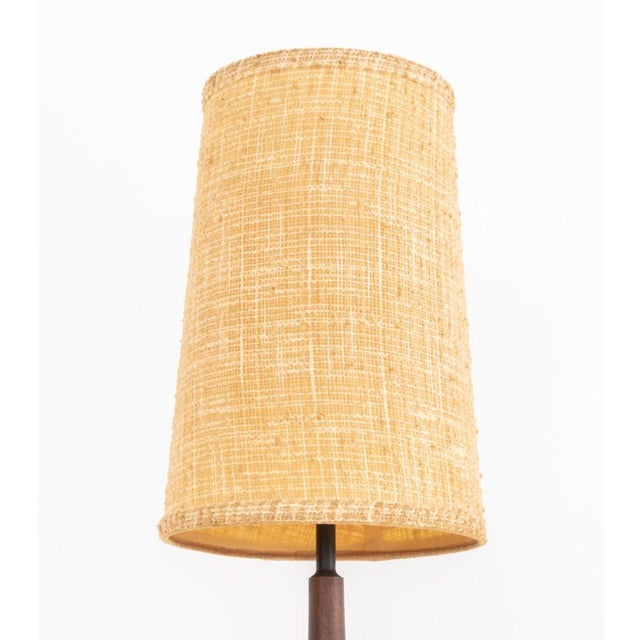Mid-Century Modern Teak Table Lamp, the vasiform base surmounted by original cylindrical shade. Overall: 35" H x 10.25"...