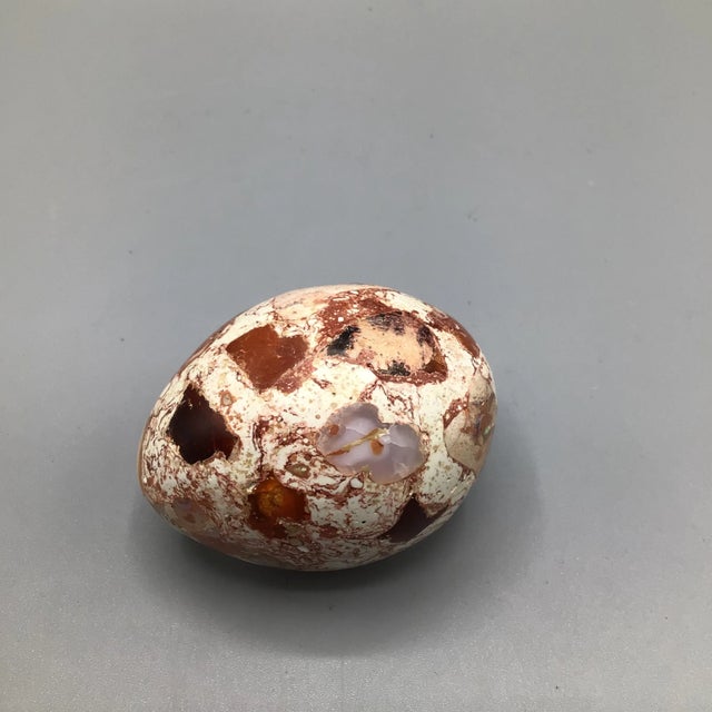 Two made in Mexico onyx eggs and one Mexican matrix fire opal egg.