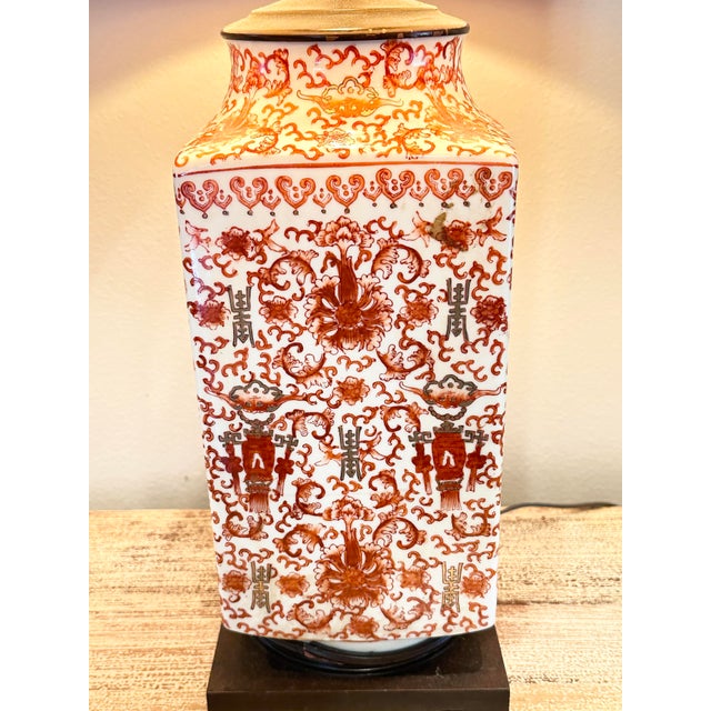Add a bold pop of color and classic pattern to your space with this stunning Chinoiserie-style table lamp. The base...