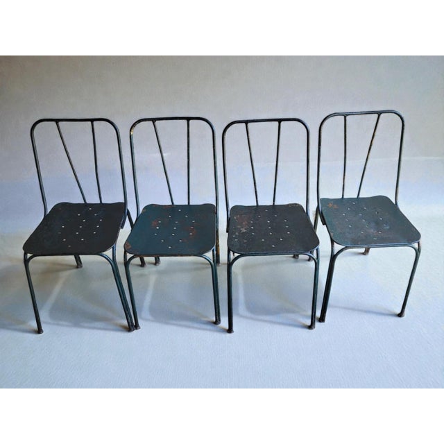 Four garden chairs from Parc et Jardin de Paris, 1950s. Wrought iron frame / Sheet metal seat. Height 82 cm Seat height 41...