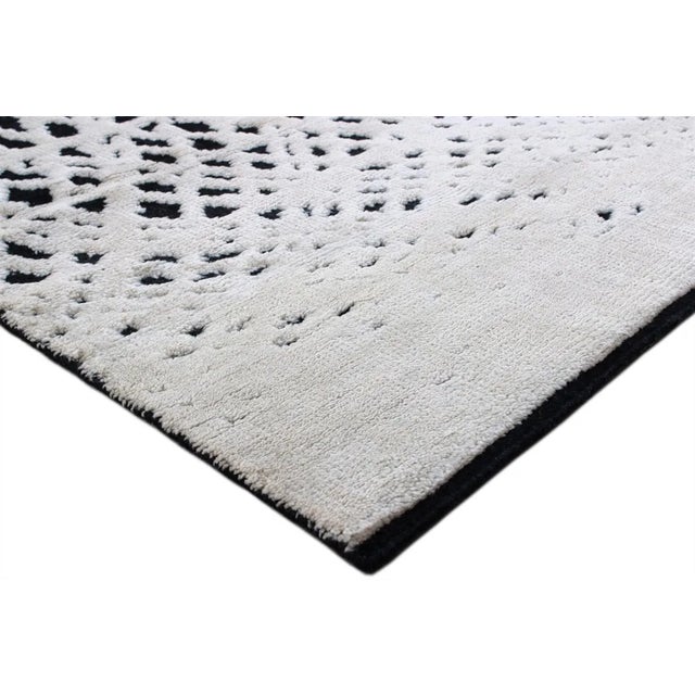 Beautiful hand knotted modern and fashionable collection of borderless designs rug, made of 75% wool and 25% cotton in...