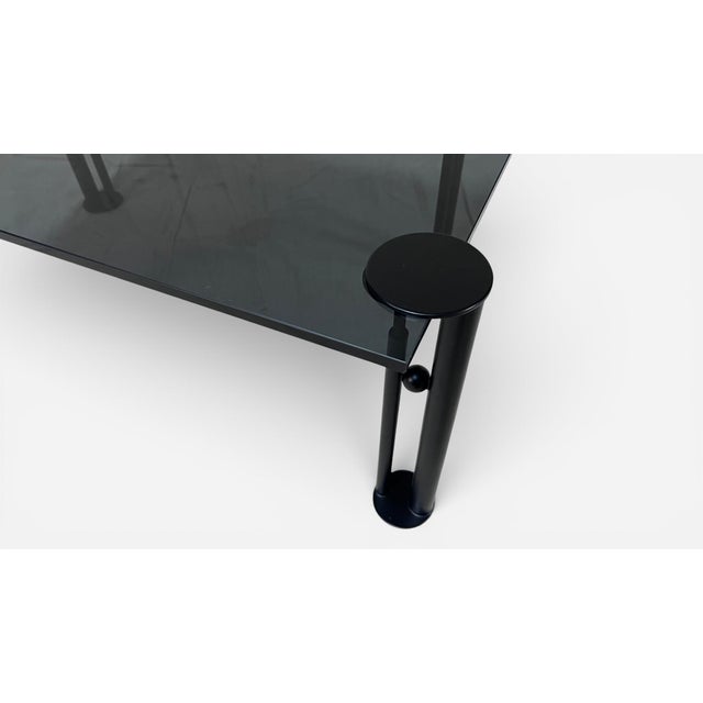 Set of 4 legs Attributed to Phillipe Starck's Joe Ship collection, paired with a smoked glass table top. Petite enough for...