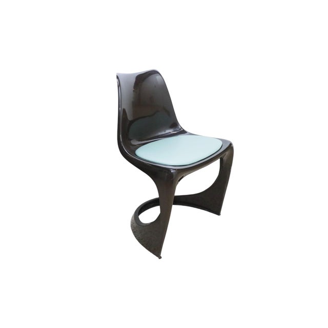 A set of four Danish Cado chairs attributed to Steen Østergaard for Poul Cadovius circa 1966. Dark brown molded chairs...