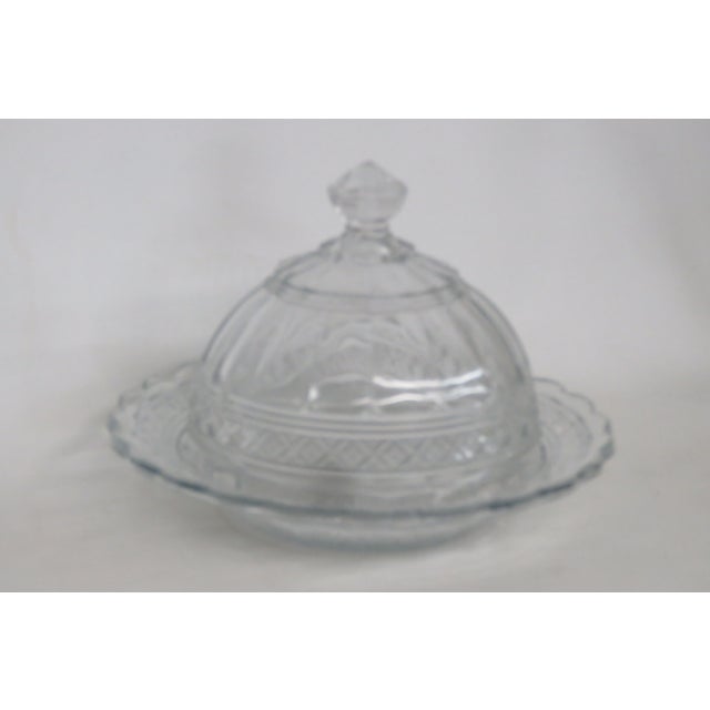 This stunning butter / cheese serving dish is made of pressed glass. This dish features the Indiana Glass Star Band...