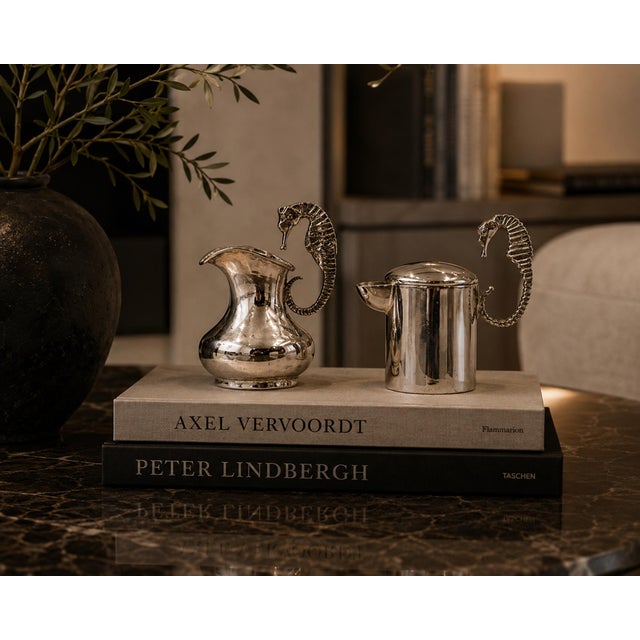 An exceptional mid-century Los Castillo silver-plated creamer and lidded sugar set, handcrafted in Taxco, Mexico during...