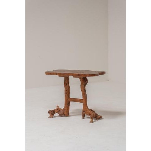 Charming handcrafted side table made entirely from solid wood, showcasing a beautifully organic, sculptural design. The...