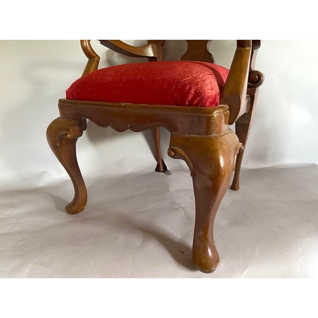 A charming early 20th-century Queen Anne-style small chair, beautifully crafted from solid mahogany and upholstered in...