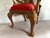 A charming early 20th-century Queen Anne-style small chair, beautifully crafted from solid mahogany and upholstered in...