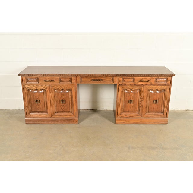 A gorgeous Scandinavian or Nordic "Viking Oak" executive credenza or desk return By Romweber USA, Circa 1960s Carved oak,...