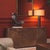 Dresser in light walnut veneer with a smooth finish. Its four doors feature a decorative inlay pattern on the front and...