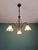 Art Nouveau brass chandelier with three arms and scalloped frosted glass shades, circa 1900-1910. Compatible with B22 LED...