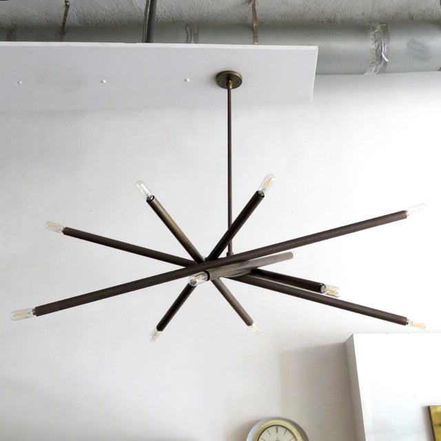 Stunning oval-shaped six-arm, twelve-light chandelier, model VL-6, designed by Gallery L7, handcrafted and finished in Los...