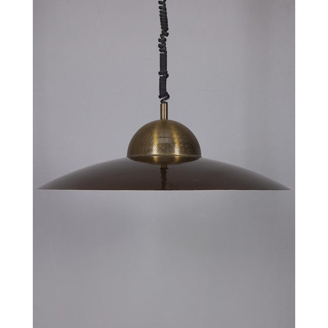 Up-and-down chandelier with gold-plated brass structure and brown metal lampshade, Italian design, 1970s. Up to 250V...