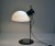 Table lamp produced by Zonca, 1970s. Structure in chromed and painted metal, diffuser in blown glass adjustable in height....