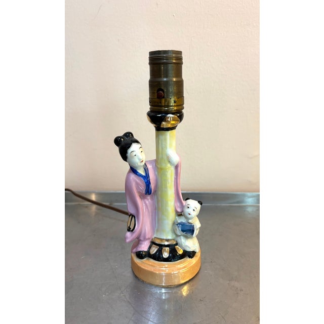 1940s-50s small painted ceramic Chinese woman w/ baby table lamp. Excellent condition. Measurements 9.5" tall to tip of...