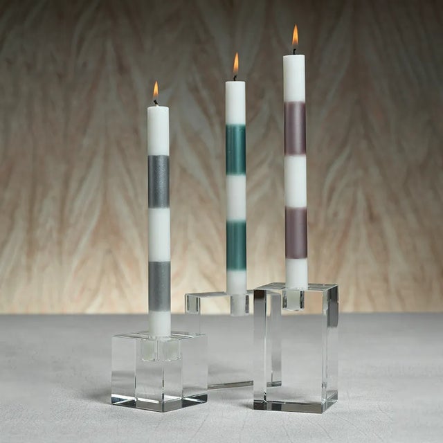 Light up the room with contemporary style with this simple but elegant taper candle holder, featuring a sleek clear clean...