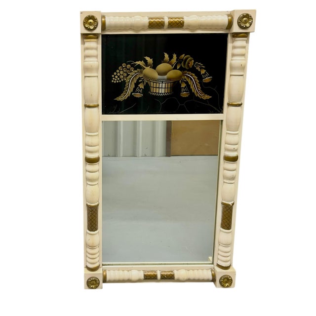 Elegant vintage Federal-style églomisé mirror by Hitchcock, featuring a distinctive ivory-toned frame with gilt accents...