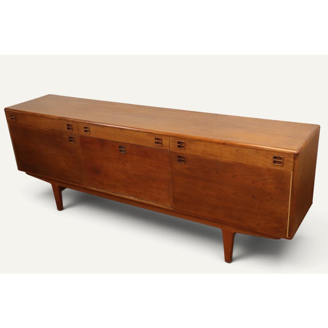 An elegant Scandinavian teak sideboard dating from the 1960s, representative of Nordic furniture of its era and its...