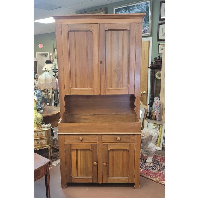 Find antique rustic farmhouse Pine blind door cupboard. Features two blind doors with two shelves over a dry sink base...