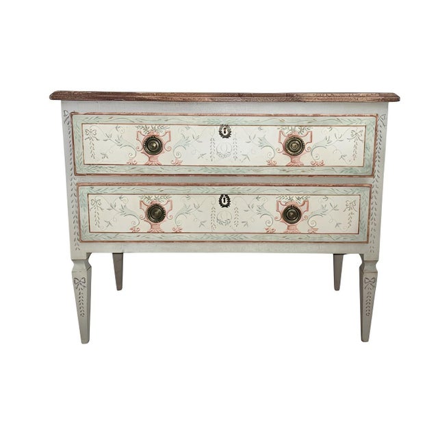 This elegant pair of Early 20th century Italian two-drawer commodes is designed in the Neoclassical taste, featuring...