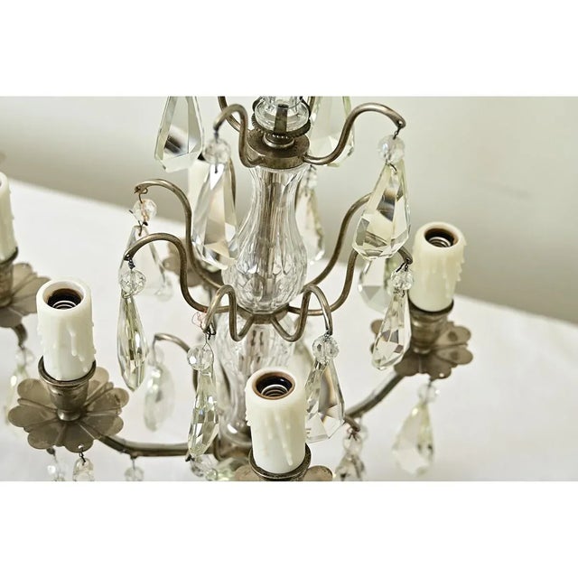 Dimensions: 20 ¾” H x 11 ¾” W x 11 ¾” D French pair of electrified girandole candelabra from the 19th century, made of...